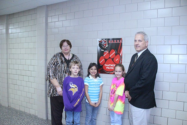 Family Services Coordinator Barb Handahl, left, and Elementary Principal Doug Anderson encourage students like Samuel Holue, Haylie Garcia and Gracie Williams to use the PRRS in and out of the school environment. - Kelly Wassenberg/Albert Lea Tribune