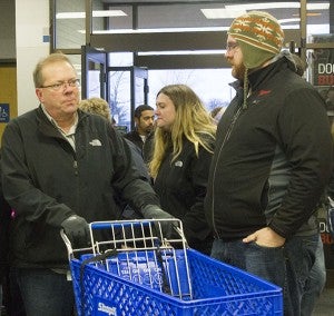 Shoppers grab carts as they walk into Shopko Thursday afternoon. - Sam Wilmes/Albert Lea Tribune