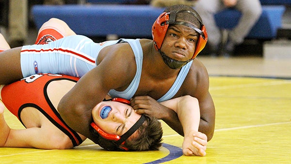 Joe Peterson of Albert Lea wrestles Coon Rapids’ Gabe Degris Saturday at 120 pounds at a tournament at Hastings. Peterson won by fall in 3:42. View a gallery of photos at albertleatribune.com. — Pam Nelson/for the Albert Lea Tribune