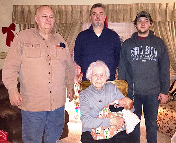 Great-great-grandmother Carmen Steele holds baby Hayden Steele while surrounded by great-grandfather Ron Steele, grandfather Troy Steele and father Brandon Steele. - Provided