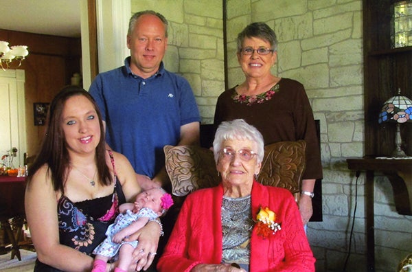 Grandfather Mike Thompson, great-grandmother Andrea Thompson, mother Megan Rauenhorst and baby Makenzie Rose Rauenhorst pose with great-great-grandmother Elvera Kabe on her 96th birthday. - Provided