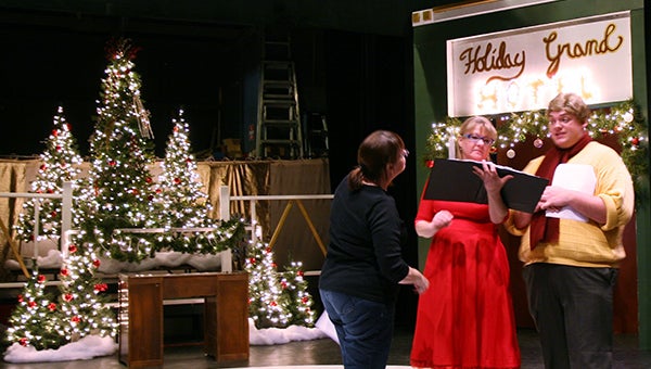 Elizabeth Harty, Jody Ellertson and Dylan Kaercher rehearse a scene from “Lights, Camera, Christmas!,” which opens Thursday at the Marion Ross Performing Arts Center in Albert Lea. - Cathy Hay/Albert Lea Tribune