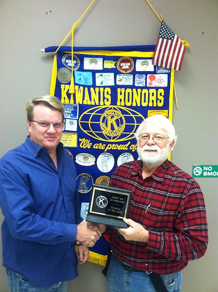 President Matt Greibrok of the Daybreakers Kiwanis Club presents Dave Mullenbach The Kiwanian of the Month Award for his involvement in the Kiwanis Club and the community for December. - Provided