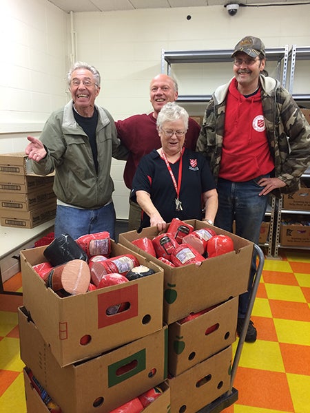 Rick Christenson of God’s Blessings, center of back row, recently donated almost 400 lbs. of meat to The Salvation Army in Albert Lea. Elsie Cline and two other volunteers accepted the donation. - Provided