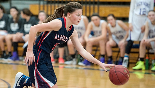Albert Lea's Rachel Rehnelt brings the ball up the court Tuesday in the second half against Red Wing at Albert Lea. — Micah Bader/Albert Lea Tribune