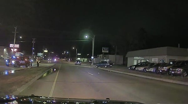 An image from an Albert Lea Police Department squad shows a blue truck pulling onto the road. The truck is a suspect vehicle in a fatal hit-and-run crash that happened Wednesday night on East Main Street. - Provided