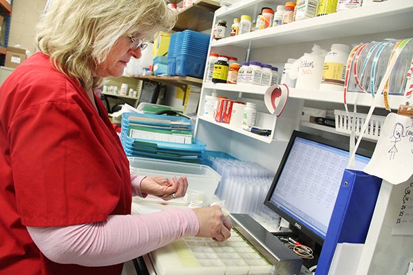 Diana Kalis, certified pharmacy technician, fills a prescription on Friday in the long-term care pharmacy at Curt’s Pharmacy. Curt’s Pharmacy has both retail and long-term care pharmacies. - Sarah Stultz/Albert Lea Tribune