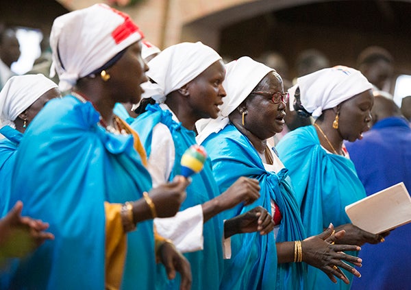 South Sudanese women dressed in traditional worship clothing sing during Christmas services Friday at First Presbyterian Church in Albert Lea. Hundreds of South Sudanese Christians from all over Minnesota gathered at the Albert Lea church for Christmas Eve and Christmas Day services. — Colleen Harrison/Albert Lea Tribune
