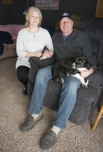 Doug Johnson sits with his wife, Evon, and one of their dogs, Angel.  — Colleen Harrison/Albert Lea Tribune