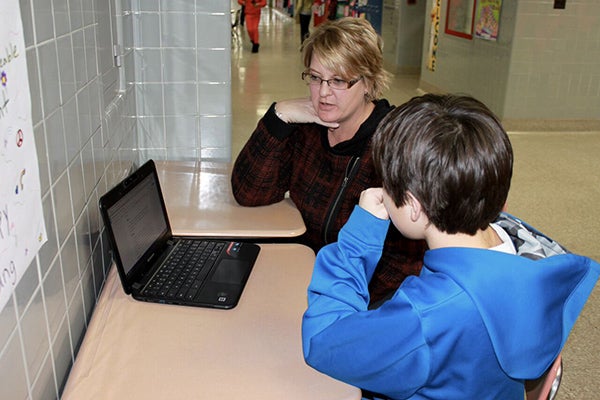 Paraprofessional Tracey Ball works with a student in Albert Lea Public Schools. - Provided