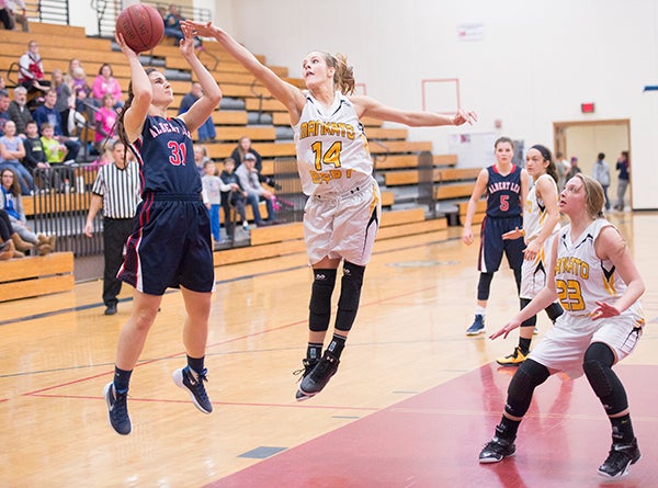 Albert Lea's Fran Eckstrom shoots while being guarded by Mankato East's Shayla Karge during Thursday's game at Albert Lea High School. - Colleen Harrison/Albert Lea Tribune