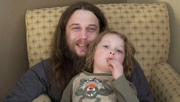 Garth Conklyn and his son, Balto, 5, safely escaped from their home at 515 Pillsbury Ave. Saturday evening with another 9-year-old child, not pictured. Sarah Stultz/Albert Lea Tribune