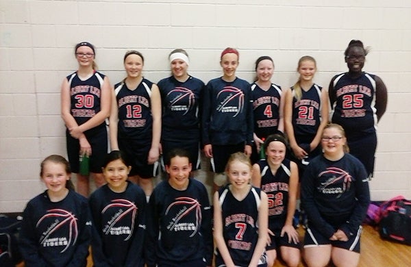 The Albert Lea sixth-grade girls’ basketball team defeated Owatonna, Lakeville South and Fairmont to take home the championship trophy Jan. 10 in Owatonna. Pictured, front row, are Lauren Fredrickson, Satera Villereal, Annika Veldman, Stephanie Vogt, Kenzie Romer and Haley Ball. Pictured, back row, are Jordan Juveland, Lindsey Bizjak, Marissa Leeman, Taya Jeffrey, Michelle Leeman, Hailey Strom and Cuodear Thoat. - Provided