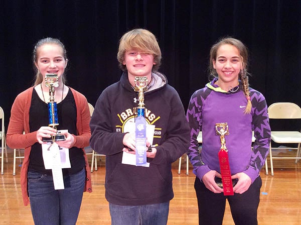 District spelling bee winner Alex Baerman, center, and second-place winner Jaeda Koziolek, left, have advanced to the regional spelling bee Feb. 9 in Rochester. Daleney Meyer, right, finished third in the competition. All three students are in the seventh grade. -Provided