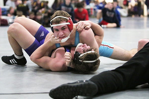 Albert Lea’s Mason Hammer wrestles Ellsworth’s Logan Melstrom at 160 Saturday during a tournament at Kasson-Mantorville. The Tigers went 2-1 at the tournament as a team and were the tournament runner-ups. Their season record is now 26-1. - Pam Nelson/For the Albert Lea Tribune