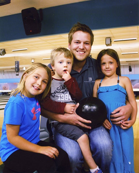 Jon Murray, pictured with his three children, bowled his third 300 game in the Monday night service club league. His teammates are Steve Barrett Jr., Michelle Nelson, Larry Fischer, Josh Ladwig and Mike Hanson. - Provided