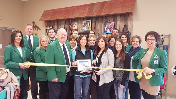 Ambassadors from the Albert Lea-Freeborn County Chamber of Commerce welcome Holly Dahl from Country Soule Boot & Western Market to the store’s new location. - Provided