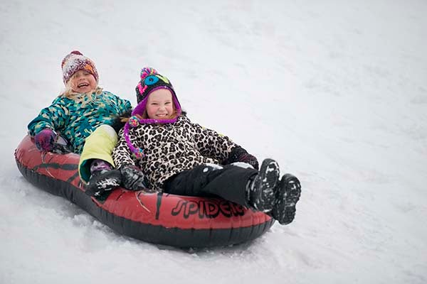 Jozie Klimmek, 8, and Attley Klemmensen, 7, go sledding Friday near Lakeview Elementary School. — Colleen Harrison/Albert Lea Tribune