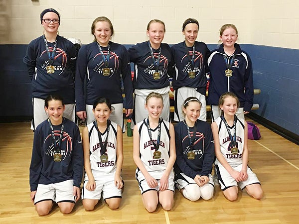 The Albert Lea girls’ sixth-grade basketball team was undefeated Feb. 6 as it beat Stewartville, Southland and Blooming Prairie to bring home first place at the Southland Youth Basketball Tournament. Pictured, front row, are Annika Veldman, Satera Villereal, Stephanie Vogt, Kenzie Romer and Lauren Fredrickson. Pictured, back row, are Jordan Juveland, Marissa Leeman, Lindsey Bizjak, Taya Jeffrey and Michelle Leeman. Not pictured are Haley Ball, Hailey Strom and Cuodear Thoat. - Provided
