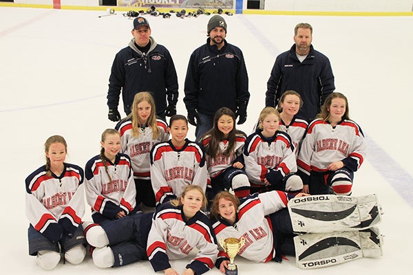 The Albert Lea U12B girls’ hockey team pictured with the home tournament third place trophy. Pictured, front row, from left, are Jaiden Venem and Emma Piechowski. Back row, from left, are Malana Thompson, Josie Venem, Emilee Schmitt, Lucy Stay, Alli Dulitz, Hannah Adams, Taylor Stanek and Katie Uthke. - Provided