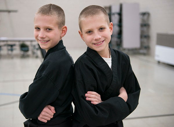 Pacey and Charley Brekke recently earned their black belts in karate. - Colleen Harrison/Albert Lea Tribune