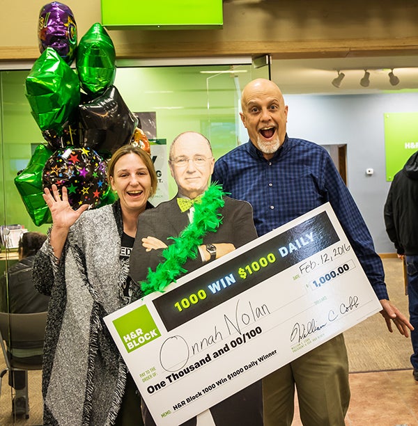 Onnah Nolan and Elias Torres each won a check for $1,000 through a nationwide campaign put on by H&R Block. One thousand winners a day were drawn to win a $1,000. The promotion ended Monday. - Provided