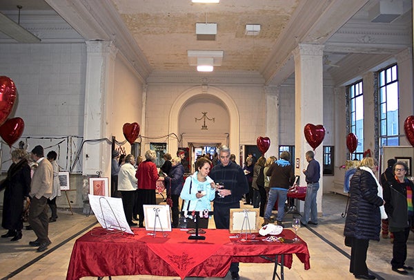 Dozens of people gathered for the “Love is in the Air” event at the former Freeborn National Bank building and The Interchange Wine & Coffee Bistro on Saturday. It was a collaboration between the Albert Lea Art Center, The Interchange and the Albert Lea Historic Preservation Commission. - Photo courtesy Dan Borland