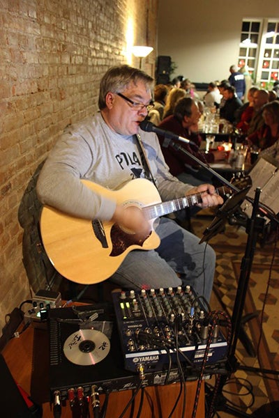 Todd Utpadel performs at The Interchange Wine & Coffee Bistro for the event. Utpadel has recorded three albums, including a country, gospel and Christmas album. - Photo courtesy of Dan Borland
