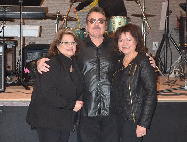 Denny Charnecki, center, stands with Irma Valens, left, and Connie Valens, sisters of Ritchie Valens, who died in a plane crash on Feb. 3, 1959. The crash claimed the lives of Valens and fellow musicians Buddy Holly and J.P. “The Big Bopper” Richardson, as well as pilot Roger Peterson. - Provided