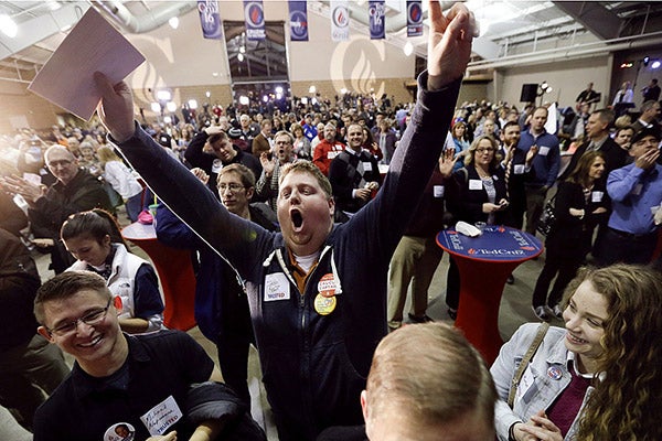 Josh Kent celebrates at a caucus night rally for Republican presidential candidate Sen. Ted Cruz, R-Texas, on Feb. 1 in Des Moines. - Charlie Neibergall/AP