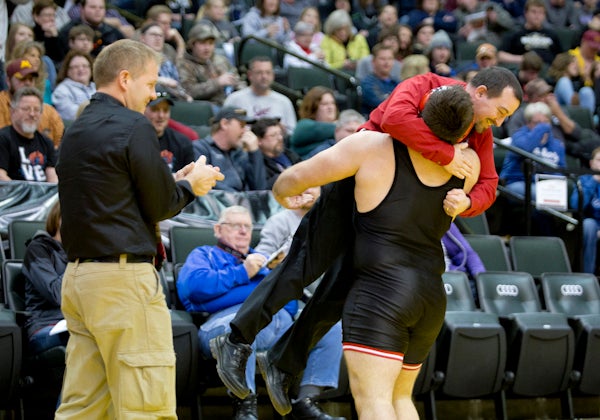 NRHEG's Wyatt Fitterer celebrates with coach Shawn Larson after winning his semifinal match against Trent Esping of Minneota Saturday at Xcel Energy Center in St. Paul. - Colleen Harrison/Albert Lea Tribune