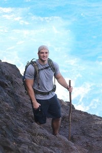 Caleb Gaudian is pictured on Crawler’s Ledge on the Kalalau Trail along the Na Pali coast in Kauai, Hawaii, while on Ultra-Hike No. 3 with his father during the 25-mile section of the hike’s 42 miles. Caleb Gaudian is serving in the U.S. Coast Guard in Oahu, Hawaii. - Provided