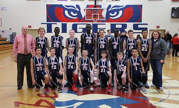 The Albert Lea eighth-grade boys’ basketball team won the championship of its home tournament. Members of the team are pictured, front row, Andrew Willner, Carson Smith, Logan Howe, Caden Gardner, Trenton Lehner, Thomas Lundell and Ismail Cabazas Jr. Pictured, back row, arecCoach Stu Hendrickson, Chase Hill, Danbil Nhail, Koby Hendrickson, Chay Guen, Connor Veldman, Pinyon Remg, Jake Weseman, Javarus Owens and coach Lana Howe. - Provided