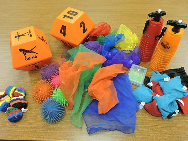 Items such as activity dice, hacky sacks, stacking cups, weighted scarves and bean bags are included in each indoor recess kit. Kelly Wassenberg/Albert Lea Tribune