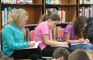 Fifth-graders at Lakeview Elementary School take part in a writing exercise during a presentation from author Douglas Wood. Sarah Stultz/Albert Lea Tribune
