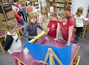 Lake Mills students present their inventions to classmates during an invention fair Tuesday. - Colleen Harrison/Albert Lea Tribune