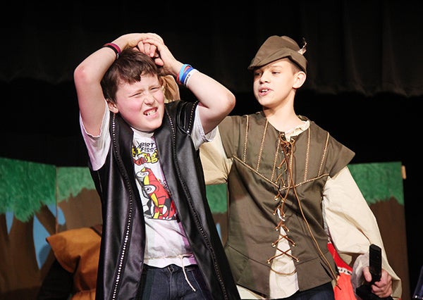Cole Janssen, right, playing Robin Hood, rehearses a scene Tuesday with Adam Semple, playing Sheriff, at Southwest Middle School. Students will perform “Robin Hood” at 7 p.m. Friday at the Little Theater of the school. - Sarah Stultz/Albert Lea Tribune