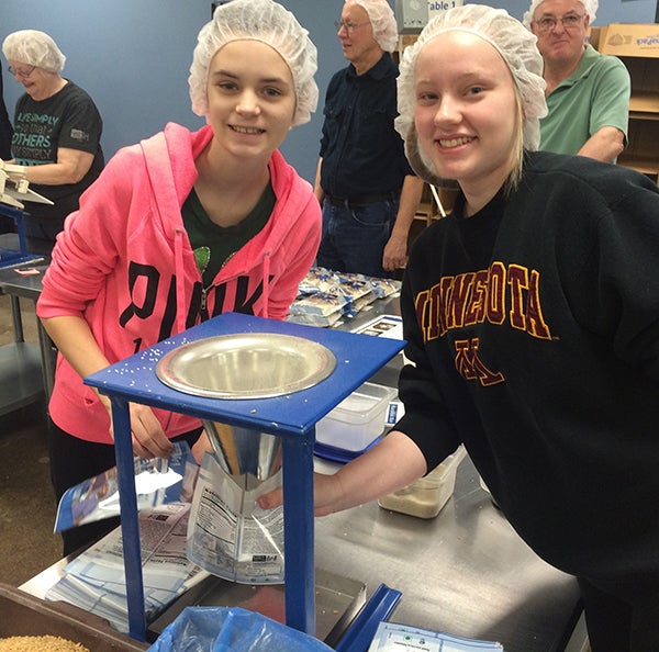 Students from the K-12 online public school MTS Minnesota Connections Academy and their families, including Albert Lea’s Kimberly Varness, right, recently volunteered at Feed My Starving Children in Eagan. The Connections Academy group packed 5,660 meals in under two hours. The field trip was organized by Connections Academy’s student council members. The school’s field trips and community events offer students, who attend the tuition-free school from home, the chance to socialize with other students, family members and faculty. -Provided