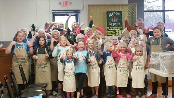 Myrtle 4-H Club members, leaders and family members packed meals for Kids Against Hunger at the Veterans of Foreign Wars in Austin before their monthly meeting this week. -Provided