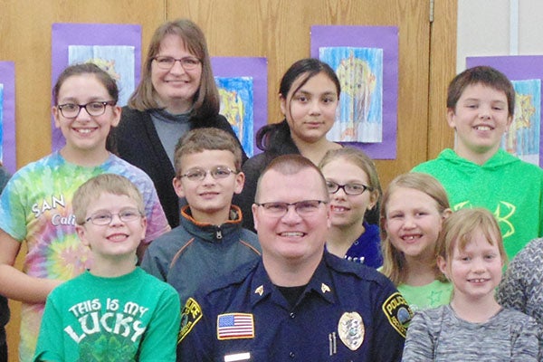 Officer Michael Drees, an officer with the Rochester Police Department and brother of St. Casimir’s Principal Joanne Tibodeau, visited with St. Casimir’s students about the ways in which his Catholic faith influences his work and everyday decisions. - Provided