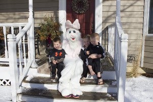 Garrett, Addyson and Grant Haugsdal receive a visit from the Easter Bunny Friday morning. - Sam Wilmes/Albert Lea Tribune
