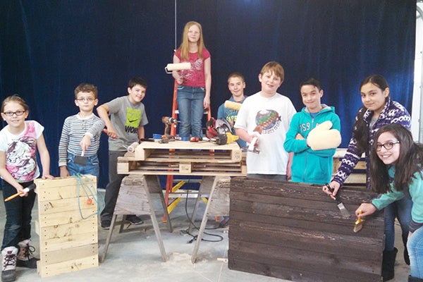 St. Casimir’s School students  work on handmade items that will go up for auction at the school’s upcoming fundraiser event, Celebrate with the Saints, which will be at 5 p.m. April 9. There will be a supper and silent and live auctions. -Provided 