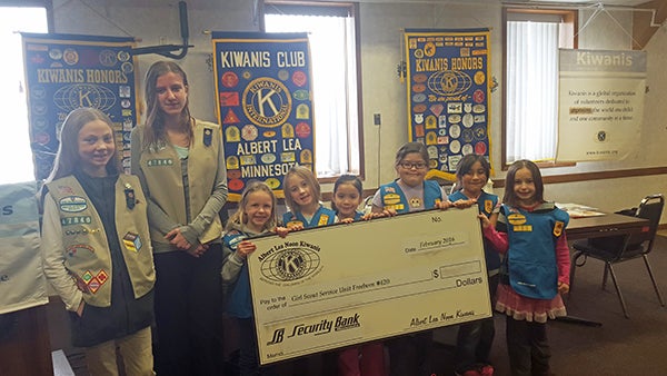 Local Girl Scouts assisted in a presentation for the Noon Kiwanis in February and accepted a donation from the group  for Girl Scouts Service Unit No. 420. - Provided