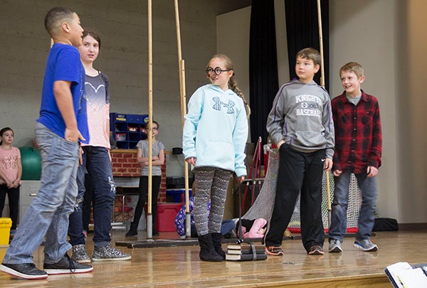 Hawthorne Elementary School students, including Sophia Brownlee, center, as Pinocchio, practice their production Wednesday afternoon at the school. After one week of practicing their parts and rehearsing, the students will present the play on Friday. - Sarah Stultz/Albert Lea Tribune