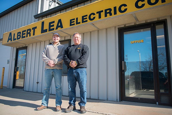 Josh Quinlivan, left, and Mick Delger work at Albert Lea Electric Co., where they say they’ve been getting more and more customer inquiries about solar power.  - Colleen Harrison/Albert Lea Tribune  
