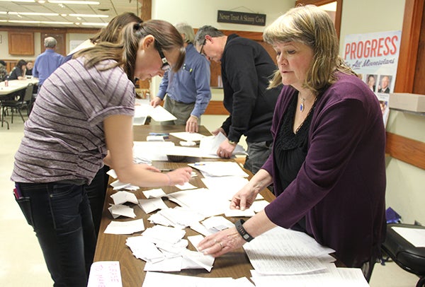 Freeborn County DFL Party Chairwoman Julie Ackland, right, sorts ballots with the help of other volunteers on Thursday night during the party's precinct caucuses. — Sarah Stultz/Albert Lea Tribune