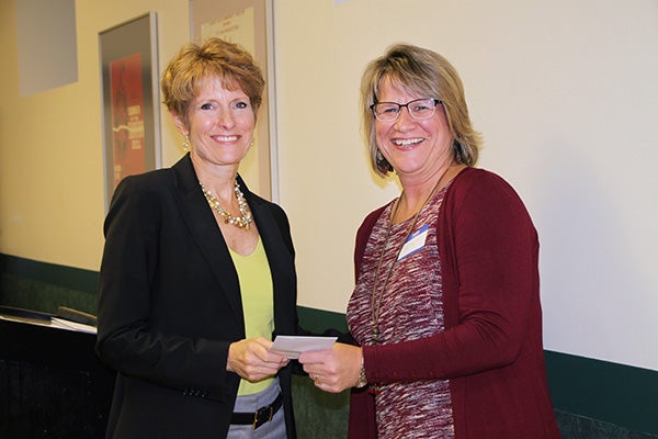 Jill Peterson, board chairwoman of the Freeborn County Community Foundation, presents Penny Jahnke, of Adult Basic Education in District 241, with a donation. — Provided