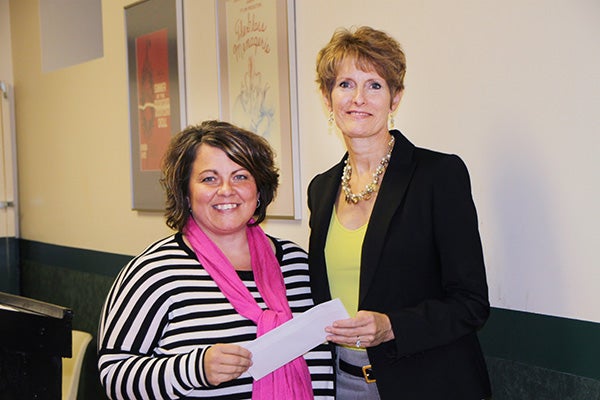 Kim Nelson of The Children’s Center accepts a donation from Jill Peterson, board chairwoman of the Freeborn County Community Foundation. — Provided