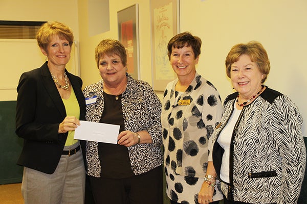 Lioba Forman, Susan Blenka and Susan Bowman from  the Lakeview Lions accept a donation from Jill Peterson, chairwoman of the Freeborn County Community Foundation. - Provided