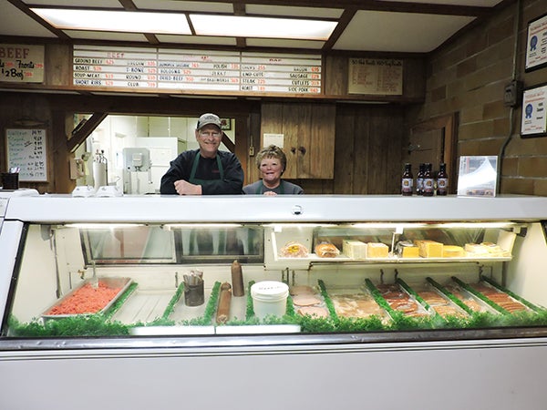 Jordahl Meats owner Brian Jordahl stands behind the counter with his full-time employee, Diane Curry. - Kelly Wassenberg/Albert Lea Tribune